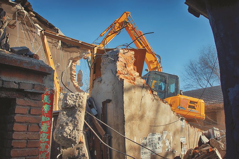 Just a few alleys away, the bulldozers had already arrived