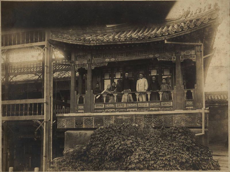 Puyi (third from right), the last emperor, with his tutor and advisor Sir Reginald Fleming Johnston (fourth from right) and his brothers on Yangxingzhai Tower in the Forbidden City