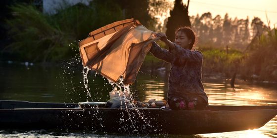 Girl washing clothes in Guangdong